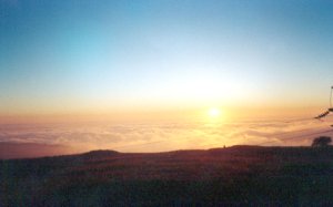 Sunset at Kanat Bakish as viewed from above the clouds